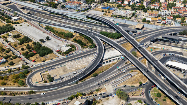 Aerial drone photo of urban multilevel highway junction road using multiple bridges forming a spaggheti road with light traffic
