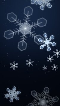 Snowflakes falling gently in a dark blue atmosphere