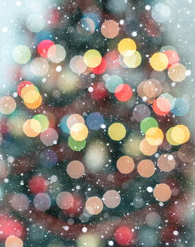 Full Frame Christmas Tree Silhouette with Warm and Cool Bokeh Lights. Snowflakes are falling
