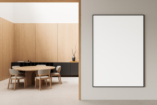 Minimalist dining room interior with oak wall panels, round wooden table, upholstered chairs, dark cabinetry, and framed art display. 3D Rendering