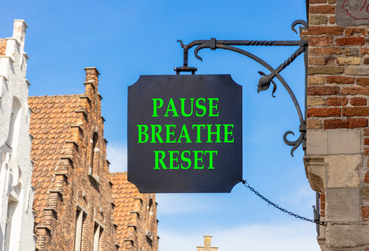 Pause breathe reset words symbol. Concept words Pause breathe reset on beautiful black road sign. Beautiful blue sky background. Business support motivational pause breathe reset concept. Copy space.