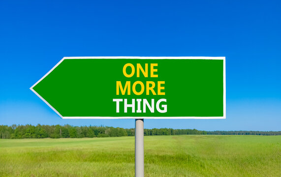 One more thing words symbol. Concept words One more thing on beautiful green road sign. Beautiful blue sky green grass background. Business and one more thing concept. Copy space.