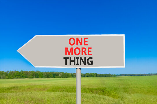 One more thing words symbol. Concept words One more thing on beautiful grey road sign. Beautiful blue sky green grass background. Business and one more thing concept. Copy space.