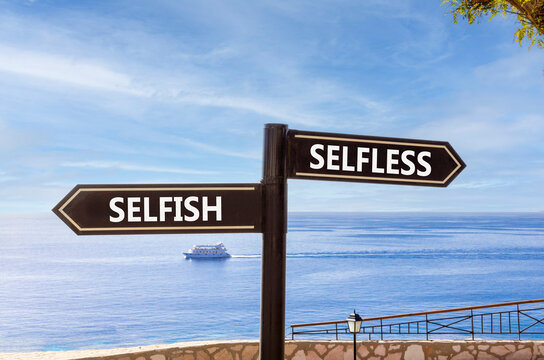 Selfless instead selfish words symbol. Concept words Selfless Selfish on beautiful black road sign. Beautiful blue sky background. Business medical psychology selfless selfish concept. Copy space.