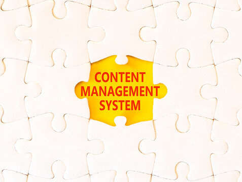 Content management system symbol. Concept words Content management system on beautiful white puzzle. Beautiful yellow background. Business content management system concept. Copy space.