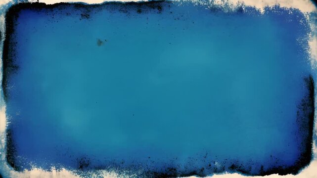 Abstract blue textured rectangles in vintage film frame effect with film grain