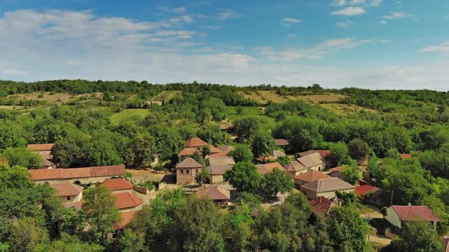 Aerial view of old rustic vintage houses with wine cellars in Rogljevacke pivnice in Negotin region of Serbia, 4k