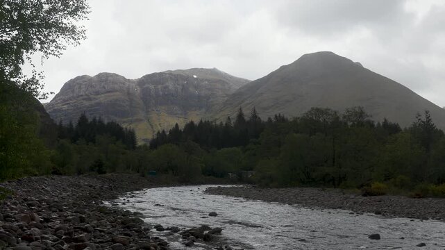 Dramatic mountain scenery with approaching stormfront in the Scottish highlands near Glencoe