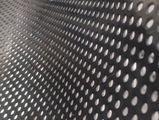 Stainless steel perforated metal sheet texture, industrial grid hole pattern background © Damar DKV