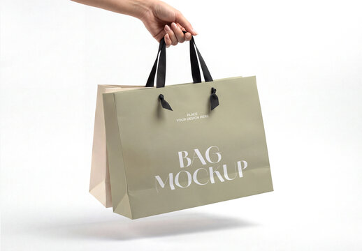 Woman Hand Holding Luxury Paper Shopping Bag Mockup