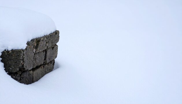 Snow Covered Concrete Blocks Half Buried in Deep Winter Snow with Copy Space