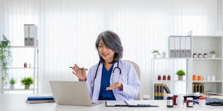 Telemedicine, healthcare and video call with doctor talking on laptop to online patient during a consultation. Happy professional offering support or medical advice by video conferrence.