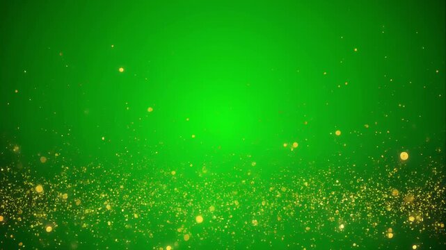 Golden glitter particles shimmering gently on a green background during soft focus bloom effect