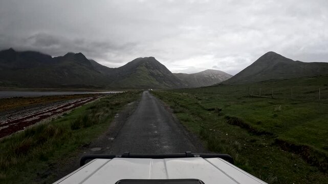 POV of a car driving along the moody coastal scenery on the Isle of Skye, Scotland