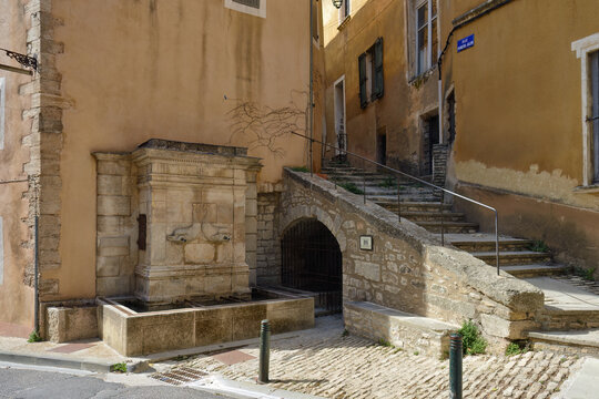 Bonnieux Dolphin Fountain with two mascarons in the shape of dolphins, Provence, France