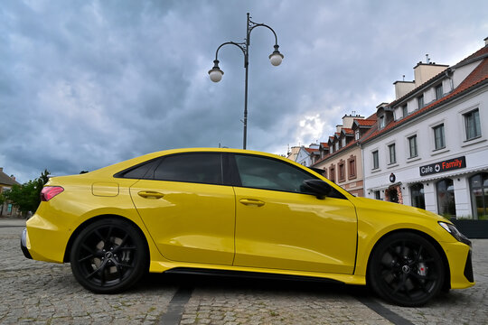Audi RS3 Sedan in Python Yellow on the Historic Streets of Pisz, Poland