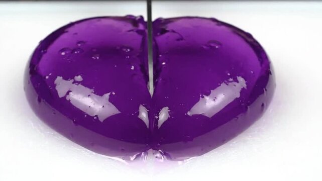 Slow Motion Knife Cutting Translucent Violet Jelly Heart with Satisfying Texture