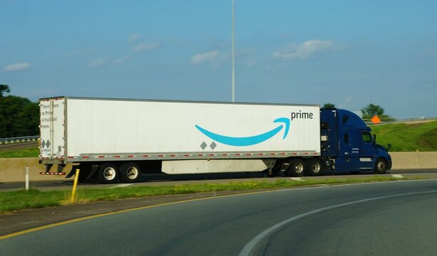 Montgomery County, Pennsylvania, U.S.A - Jul 11, 2026 - A dark blue Amazon Prime semi-truck hauling a branded trailer along a highway