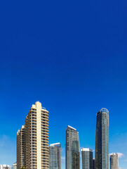 Fototapeta premium Gold Coast city skyline with modern skyscrapers against blue sky