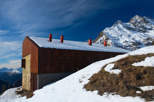 Ostello al Cur&ograve; ( alpine hostel ). In the distance, Pizzo Coca, the highest peak in the Orobie Alps.  Valbondione, Province of Bergamo, Italy
