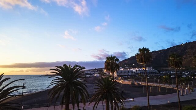 Puerto Naos sunset motion lapse panning beach palm trees promenade coastal resort La Palma Spain