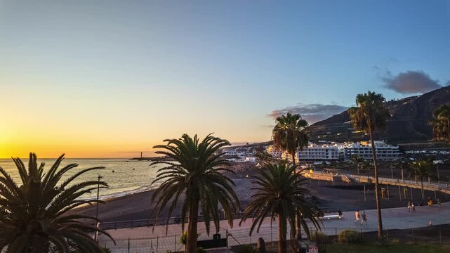 Puerto Naos sunset motion lapse right to left promenade palm trees coastal resort La Palma Spain