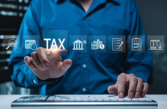 Tax Planning and Financial Compliance Concept. Businessman using computer with icons related to tax, finance, checklist, government, calendar, calculation, accounting, tax planning, Income taxation