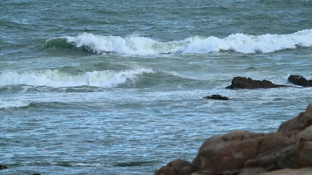 wave and rock at slow motion