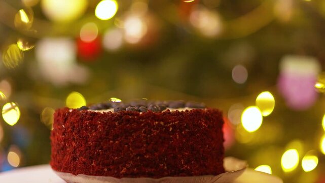 Festive Red Velvet Blueberry Cake Rotating with Sparkling Christmas Lights Background