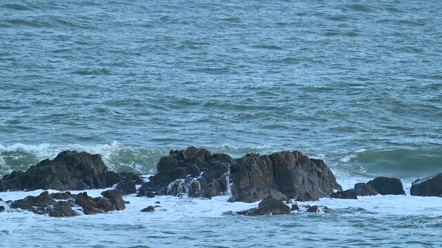 wave and rock at slow motion
