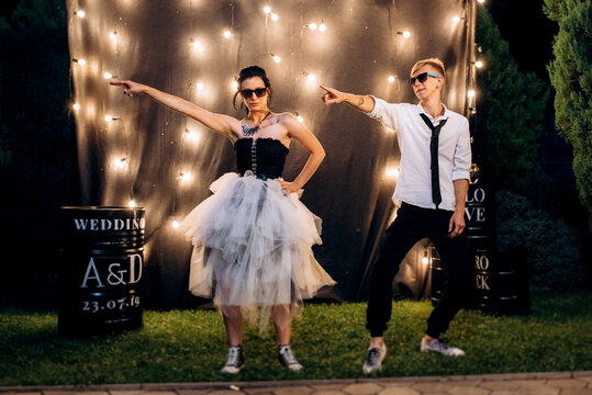 A dance of a young, unusual, freaky newlywed couple against