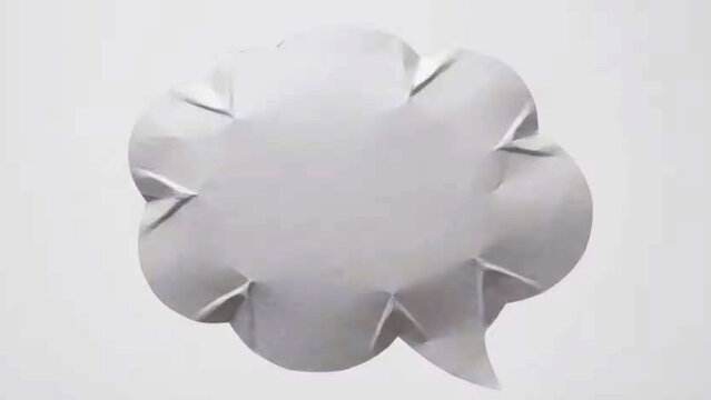 Minimalist craft paper cloud shape cut out with sharp folded isolated on clean white background. Ideal for cloud shape, craft paper, minimal cloud, paper cut art & handmade.