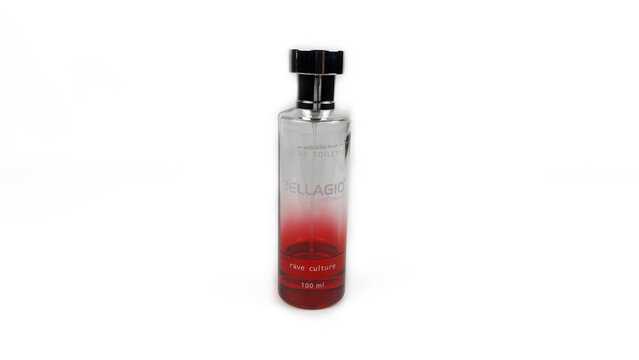 Kediri, East Java, Indonesia &ndash; August 21, 2026: Transparent Perfume Bottle with Metallic Cap and Red Liquid Displayed on White Background