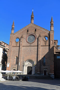 The terracotta facade of the Basilica of St. Francis of Assisi in Piacenza, a Lombard Gothic-style building