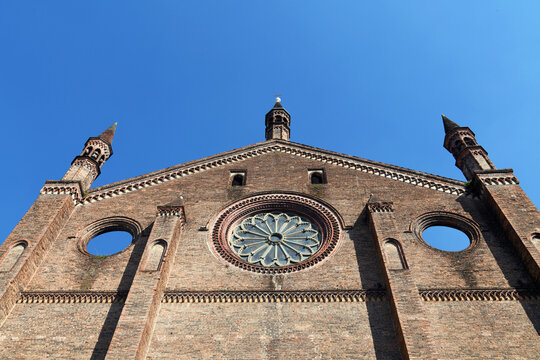 The terracotta facade of the Basilica of St. Francis of Assisi in Piacenza, a Lombard Gothic-style building