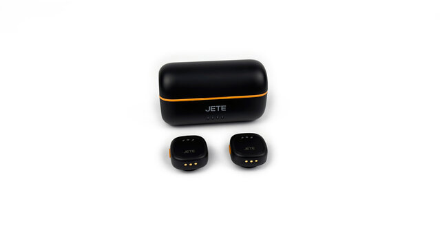 Kediri, East Java, Indonesia &ndash; August 21, 2026: Black and Orange Wireless Microphone Case with Components Displayed on White Background
