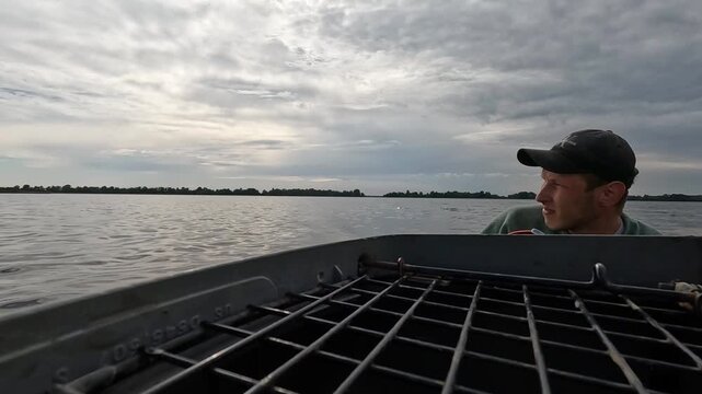 Volunteer sail on boat to evacuate animals and people after detonation of Hydroelectric Power Station. Flooding in Kherson as result of explosion of dam on Dnipro river in city of Novaya Kakhovka