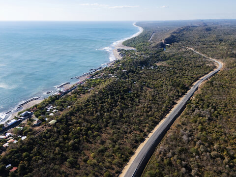Asphalt road next to ocean coast
