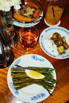 Dinner table set with dishes and drinks in restaurant