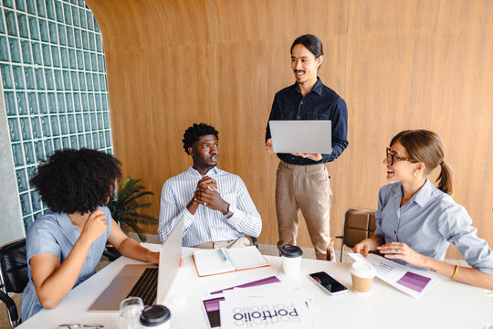 Group Meeting in a Modern Office With Diverse Participants