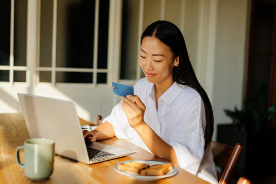 Woman making secure online payment while shopping from home