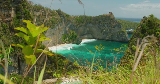 Scenic view of tropical cove with emerald ocean water and dramatic cliffs at Diamond Beach Nusa Penida Island Bali