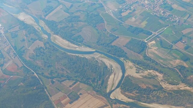 Aerial 4K video footage of drought-stricken Europe seen from above, showing major European rivers severely dried up by extreme drought, exposed riverbeds and the effects of climate change