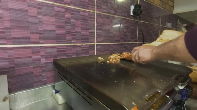 Chef Hands Stuffed Grilled Turkish Kokorets Street Food Inside Crisp Warm Toasted Bread Bread Rolls On Hot Flat Top Grill Plate In Restaurant Kitchen