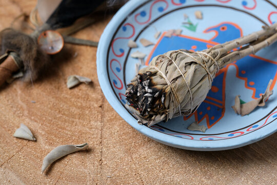 White Sage Smudge Stick on Blue Decorative Plate with Feather
