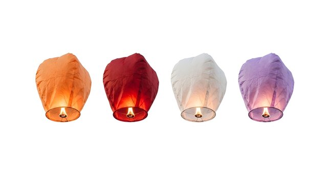 Four colorful floating sky lanterns isolated on white background