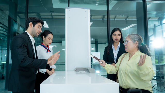 A tense discussion unfolds between a passenger and airport personnel at a modern terminal counter illustrating dissatisfaction complaint management and service challenges.
