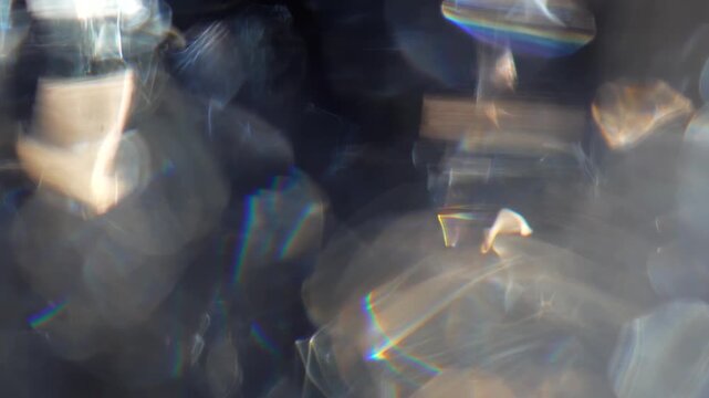 Blurred, defocused background with rainbow refractions and glowing bokeh. Concept optical abstraction for design, overlay, ads, websites, banners, magazines and presentations.