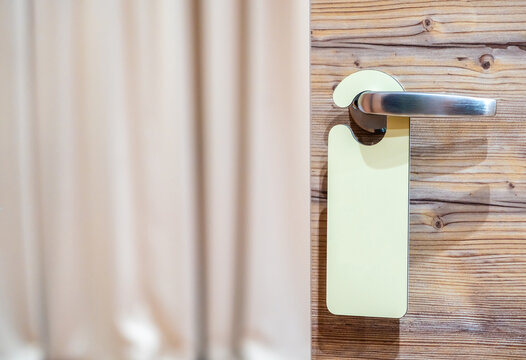 An empty sign on the hotel door handle for your text