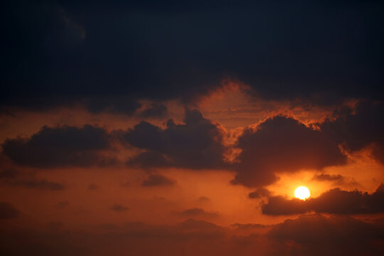 dramatic sunset in the sky with clouds